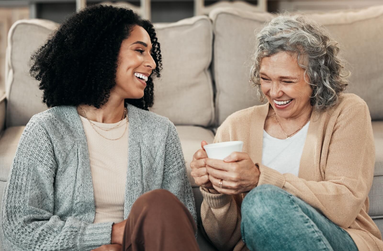 An adult uses morning coffee time as a way to ease into talking to their senior parent about assisted living